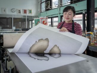 Woman Working in Printing Workshop