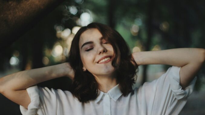 Photo by Oleg Ivanov woman smiling selective photography